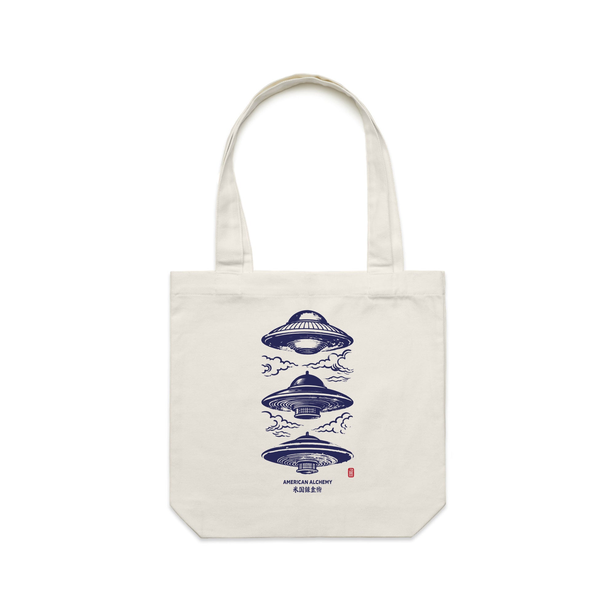 Cream tote bag with blue UFO design on a white background